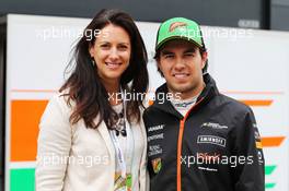 (L to R): Hannah White (GBR) Broadcaster, Sailor and Adventurer with Sergio Perez (MEX) Sahara Force India F1. 08.07.2014. Formula One Testing, Silverstone, England, Tuesday.