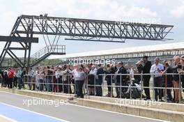 Fans in the pits. 09.07.2014. Formula One Testing, Silverstone, England, Wednesday.