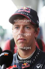 Sebastian Vettel (GER) Red Bull Racing with the media. 09.07.2014. Formula One Testing, Silverstone, England, Wednesday.