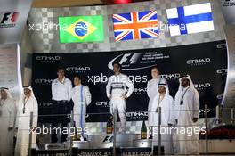 The podium (L to R): Felipe Massa (BRA) Williams, second; Lewis Hamilton (GBR) Mercedes AMG F1, race winner and World Champion; Valtteri Bottas (FIN) Williams, third. 23.11.2014. Formula 1 World Championship, Rd 19, Abu Dhabi Grand Prix, Yas Marina Circuit, Abu Dhabi, Race Day.