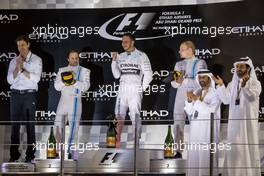 The podium (L to R): Felipe Massa (BRA) Williams, second; Lewis Hamilton (GBR) Mercedes AMG F1, race winner and World Champion; Valtteri Bottas (FIN) Williams, third. 23.11.2014. Formula 1 World Championship, Rd 19, Abu Dhabi Grand Prix, Yas Marina Circuit, Abu Dhabi, Race Day.