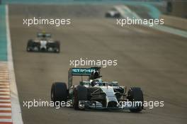 Lewis Hamilton (GBR) Mercedes AMG F1 W05 leads the race from team mate Nico Rosberg (GER) Mercedes AMG F1 W05. 23.11.2014. Formula 1 World Championship, Rd 19, Abu Dhabi Grand Prix, Yas Marina Circuit, Abu Dhabi, Race Day.