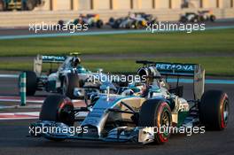 Lewis Hamilton (GBR) Mercedes AMG F1 W05 leads team mate Nico Rosberg (GER) Mercedes AMG F1 W05. 23.11.2014. Formula 1 World Championship, Rd 19, Abu Dhabi Grand Prix, Yas Marina Circuit, Abu Dhabi, Race Day.