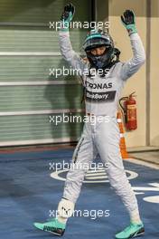 Nico Rosberg (GER) Mercedes AMG F1 celebrates his pole position in parc ferme. 22.11.2014. Formula 1 World Championship, Rd 19, Abu Dhabi Grand Prix, Yas Marina Circuit, Abu Dhabi, Qualifying Day.