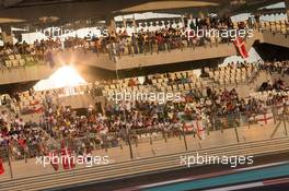 Fans in the grandstand. 23.11.2014. Formula 1 World Championship, Rd 19, Abu Dhabi Grand Prix, Yas Marina Circuit, Abu Dhabi, Race Day.