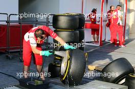 Ferrari mechanic washes Pirelli tyres. 25.11.2014. Formula 1 Testing, Day One, Yas Marina Circuit, Abu Dhabi, Tuesday.