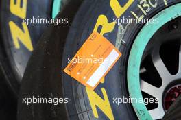 Pirelli tyre with inspection sticker. 25.11.2014. Formula 1 Testing, Day One, Yas Marina Circuit, Abu Dhabi, Tuesday.