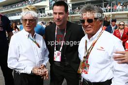(L to R): Bernie Ecclestone (GBR) with  Keanu Reeves (USA) Actor and Mario Andretti (USA) Circuit of The Americas' Official Ambassador on the grid. 02.11.2014. Formula 1 World Championship, Rd 17, United States Grand Prix, Austin, Texas, USA, Race Day.