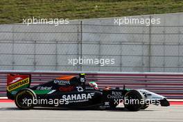 Sergio Perez (MEX) Sahara Force India F1 VJM07 returns to the pits after damaging his car on the opening lap of the race. 02.11.2014. Formula 1 World Championship, Rd 17, United States Grand Prix, Austin, Texas, USA, Race Day.