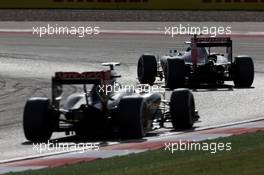 Jean-Eric Vergne (FRA) Scuderia Toro Rosso STR9 leads Romain Grosjean (FRA) Lotus F1 E22. 02.11.2014. Formula 1 World Championship, Rd 17, United States Grand Prix, Austin, Texas, USA, Race Day.