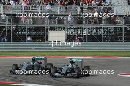 Lewis Hamilton (GBR) Mercedes AMG F1 W05 passes team mate Nico Rosberg (GER) Mercedes AMG F1 W05 to take the lead of the race. 02.11.2014. Formula 1 World Championship, Rd 17, United States Grand Prix, Austin, Texas, USA, Race Day.