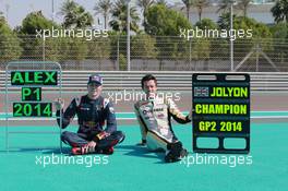 (L to R): Alex Lynn (GBR) Carlin, 2014 GP3 Champion with Jolyon Palmer (GBR) Dams,  2014 GP2 Champion. 23.11.2014. GP2 Series, Rd 11, Yas Marina Circuit, Abu Dhabi, UAE, Sunday.