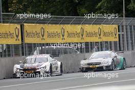 Marco Wittmann (GER) BMW Team RMG BMW M4 DTM, Daniel Juncadella (ESP) Mücke Motorsport Mercedes-AMG C63 DTM 27.06.2015, DTM Round 3, Norisring, Germany, Race 1, Saturday.