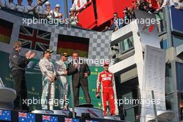 The podium (L to R): Nico Rosberg (GER) Mercedes AMG F1, second; Lewis Hamilton (GBR) Mercedes AMG F1, race winner; Arnold Schwarzenegger (USA); Sebastian Vettel (GER) Ferrari, third  15.03.2015. Formula 1 World Championship, Rd 1, Australian Grand Prix, Albert Park, Melbourne, Australia, Race Day.