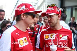 (L to R): Kimi Raikkonen (FIN) Ferrari with Sebastian Vettel (GER) Ferrari. 15.03.2015. Formula 1 World Championship, Rd 1, Australian Grand Prix, Albert Park, Melbourne, Australia, Race Day.