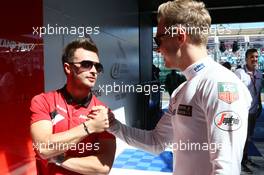 (L to R): Will Stevens (GBR) Manor Marussia F1 Team with Kevin Magnussen (DEN) McLaren. 15.03.2015. Formula 1 World Championship, Rd 1, Australian Grand Prix, Albert Park, Melbourne, Australia, Race Day.