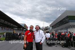 (L to R): Graeme Lowdon (GBR) Manor Marussia F1 Team Chief Executive Officer with Eric Boullier (FRA) McLaren Racing Director on the grid. 21.06.2015. Formula 1 World Championship, Rd 8, Austrian Grand Prix, Spielberg, Austria, Race Day.