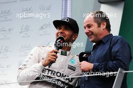 (L to R): second placed Lewis Hamilton (GBR) Mercedes AMG F1 on the podium with Gerhard Berger (AUT). 21.06.2015. Formula 1 World Championship, Rd 8, Austrian Grand Prix, Spielberg, Austria, Race Day.
