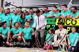 Race winner Nico Rosberg (GER) Mercedes AMG F1 and team mate Lewis Hamilton (GBR) Mercedes AMG F1 celebrate with the team. 21.06.2015. Formula 1 World Championship, Rd 8, Austrian Grand Prix, Spielberg, Austria, Race Day.