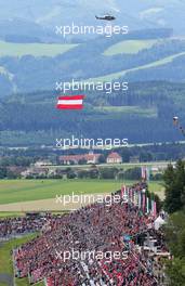 A helicopter with the Austrian flag. 21.06.2015. Formula 1 World Championship, Rd 8, Austrian Grand Prix, Spielberg, Austria, Race Day.