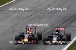 (L to R): Daniel Ricciardo (AUS) Red Bull Racing RB11 and Max Verstappen (NLD) Scuderia Toro Rosso STR10 battle for position. 21.06.2015. Formula 1 World Championship, Rd 8, Austrian Grand Prix, Spielberg, Austria, Race Day.