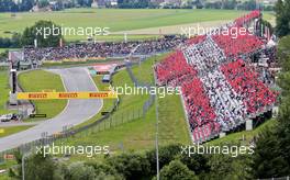 Fans in the grandstand recreate the Austrian flag. 21.06.2015. Formula 1 World Championship, Rd 8, Austrian Grand Prix, Spielberg, Austria, Race Day.