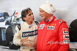(L to R): Nelson Piquet (BRA) and Niki Lauda (AUT) Mercedes Non-Executive Chairman at the Legends Parade. 20.06.2015. Formula 1 World Championship, Rd 8, Austrian Grand Prix, Spielberg, Austria, Qualifying Day.