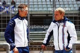 (L to R): Antti Vierula (FIN) Personal Trainer with Valtteri Bottas (FIN) Williams. 23.06.2015. Formula 1 Testing, Day One, Spielberg, Austria, Tuesday.