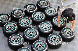 Pirelli tyres and a Mercedes AMG F1 mechanic. 12.05.2015. Formula 1 Testing, Day One, Barcelona, Spain, Tuesday.