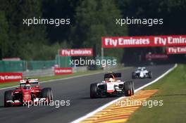 (L to R): Kimi Raikkonen (FIN) Ferrari SF15-T and Roberto Merhi (ESP) Manor Marussia F1 Team. 21.08.2015. Formula 1 World Championship, Rd 11, Belgian Grand Prix, Spa Francorchamps, Belgium, Practice Day.