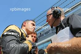 (L to R): Pastor Maldonado (VEN) Lotus F1 Team on the grid with Mark Slade (GBR) Lotus F1 Team Race Engineer. 23.08.2015. Formula 1 World Championship, Rd 13, Belgian Grand Prix, Spa Francorchamps, Belgium, Race Day.