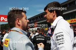 (L to R): Paul Hembery (GBR) Pirelli Motorsport Director with Toto Wolff (GER) Mercedes AMG F1 Shareholder and Executive Director. 23.08.2015. Formula 1 World Championship, Rd 13, Belgian Grand Prix, Spa Francorchamps, Belgium, Race Day.