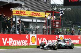 Race winner Lewis Hamilton (GBR) Mercedes AMG F1 W06 celebrates as he takes the chequered flag at the end of the race. 23.08.2015. Formula 1 World Championship, Rd 13, Belgian Grand Prix, Spa Francorchamps, Belgium, Race Day.
