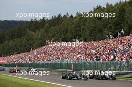 Lewis Hamilton (GBR) Mercedes AMG F1 W06 and Sergio Perez (MEX) Sahara Force India F1 VJM08 battle for the lead at the start of the race. 23.08.2015. Formula 1 World Championship, Rd 13, Belgian Grand Prix, Spa Francorchamps, Belgium, Race Day.
