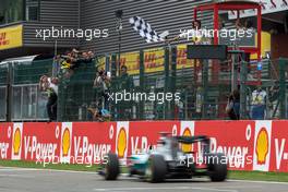Race winner Lewis Hamilton (GBR) Mercedes AMG F1 W06 takes the chequered flag at the end of the race. 23.08.2015. Formula 1 World Championship, Rd 13, Belgian Grand Prix, Spa Francorchamps, Belgium, Race Day.