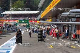 Lotus F1 Team and Williams mechanics walk down the pit lane. 22.08.2015. Formula 1 World Championship, Rd 11, Belgian Grand Prix, Spa Francorchamps, Belgium, Qualifying Day.