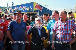Bernie Ecclestone (GBR) meets Belgian farmers who protest with a cow in a campagin for a fair price for their milk.