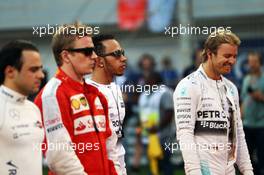(L to R): Felipe Massa (BRA) Williams; Kimi Raikkonen (FIN) Ferrari; Lewis Hamilton (GBR) Mercedes AMG F1 and Nico Rosberg (GER) Mercedes AMG F1 on the grid. 19.04.2015. Formula 1 World Championship, Rd 4, Bahrain Grand Prix, Sakhir, Bahrain, Race Day.