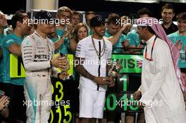Third placed Nico Rosberg (GER) Mercedes AMG F1 and race winner Lewis Hamilton (GBR) Mercedes AMG F1 celebrate with the team. 19.04.2015. Formula 1 World Championship, Rd 4, Bahrain Grand Prix, Sakhir, Bahrain, Race Day.
