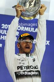 Race winner Lewis Hamilton (GBR) Mercedes AMG F1 celebrates on the podium. 19.04.2015. Formula 1 World Championship, Rd 4, Bahrain Grand Prix, Sakhir, Bahrain, Race Day.