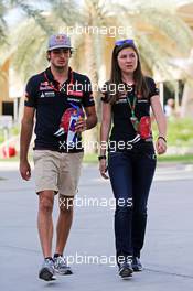 Carlos Sainz Jr (ESP) Scuderia Toro Rosso with Tabatha Valles (ESP) Scuderia Toro Rosso Press Officer. 19.04.2015. Formula 1 World Championship, Rd 4, Bahrain Grand Prix, Sakhir, Bahrain, Race Day.