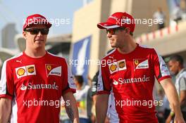 (L to R): Kimi Raikkonen (FIN) Ferrari with team mate Sebastian Vettel (GER) Ferrari on the drivers parade. 19.04.2015. Formula 1 World Championship, Rd 4, Bahrain Grand Prix, Sakhir, Bahrain, Race Day.