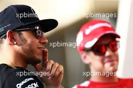 (L to R): Lewis Hamilton (GBR) Mercedes AMG F1 with Sebastian Vettel (GER) Ferrari. 16.04.2015. Formula 1 World Championship, Rd 4, Bahrain Grand Prix, Sakhir, Bahrain, Preparation Day.