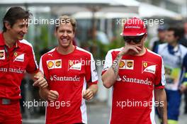 (L to R): Massimo Rivola (ITA) Ferrari Sporting Director with Sebastian Vettel (GER) Ferrari and Kimi Raikkonen (FIN) Ferrari. 13.11.2015. Formula 1 World Championship, Rd 18, Brazilian Grand Prix, Sao Paulo, Brazil, Practice Day.