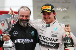 The podium (L to R): James Wade (GBR) Darts Player celebrates with race winner Nico Rosberg (GER) Mercedes AMG F1. 15.11.2015. Formula 1 World Championship, Rd 18, Brazilian Grand Prix, Sao Paulo, Brazil, Race Day.