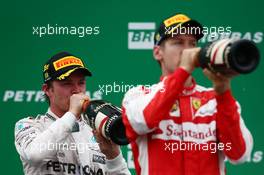 1st place Nico Rosberg (GER) Mercedes AMG F1 W06 with 3rd place Sebastian Vettel (GER) Ferrari SF15-T. 15.11.2015. Formula 1 World Championship, Rd 18, Brazilian Grand Prix, Sao Paulo, Brazil, Race Day.