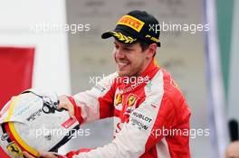 Sebastian Vettel (GER) Ferrari celebrates his third position on the podium. 15.11.2015. Formula 1 World Championship, Rd 18, Brazilian Grand Prix, Sao Paulo, Brazil, Race Day.