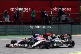 Sergio Perez (MEX) Sahara Force India F1 VJM08 and Max Verstappen (NLD) Scuderia Toro Rosso STR10 battle for position. 15.11.2015. Formula 1 World Championship, Rd 18, Brazilian Grand Prix, Sao Paulo, Brazil, Race Day.