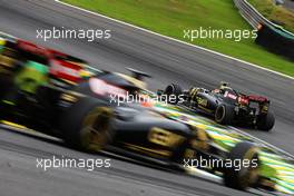 Pastor Maldonado (VEN) Lotus F1 E23 leads team mate Romain Grosjean (FRA) Lotus F1 E23. 15.11.2015. Formula 1 World Championship, Rd 18, Brazilian Grand Prix, Sao Paulo, Brazil, Race Day.