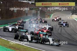Nico Rosberg (GER) Mercedes AMG F1 W06 (Right) leads team mate Lewis Hamilton (GBR) Mercedes AMG F1 W06 at the start of the race. 15.11.2015. Formula 1 World Championship, Rd 18, Brazilian Grand Prix, Sao Paulo, Brazil, Race Day.